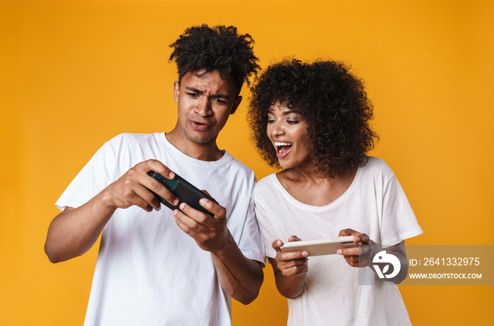 Photo of african american people playing online game on cellphone