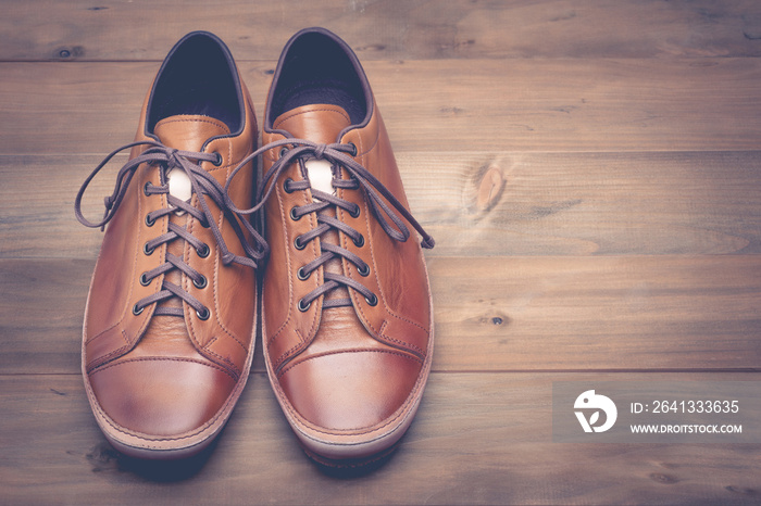 A pair of brown leather shoes with vintage