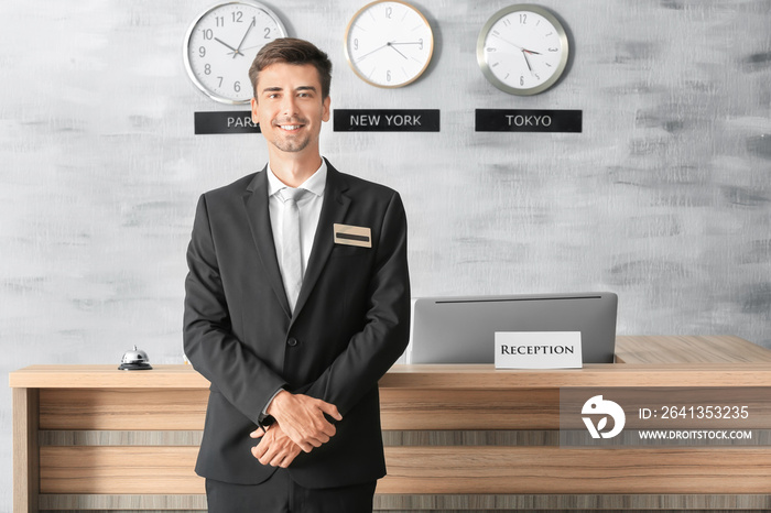 Male receptionist working in hotel