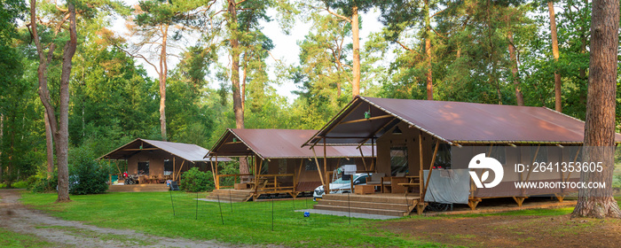 Glamping at a campsite. Luxury tent lodges with all kinds of services for glamorous stay outdoors