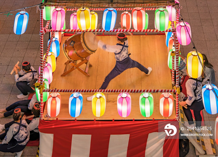 View of the square in front of the Nippori train station decorated for the Obon festival with a yagu