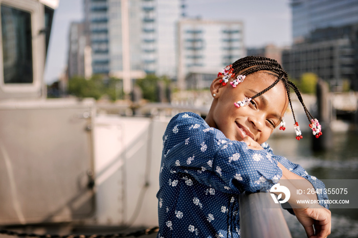 Portrait of girl leaning on railing