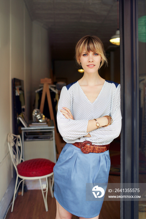 Portrait of owner standing at doorway