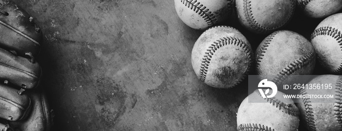 old grunge texture with baseball glove and balls as frame for background in black and white.