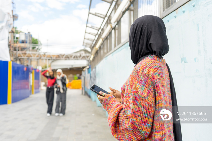 Young women wearing hijabs in city