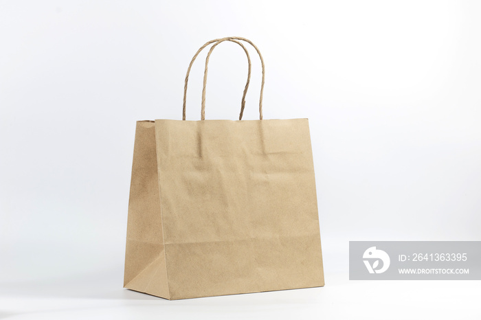 Paper shopping bag on white background