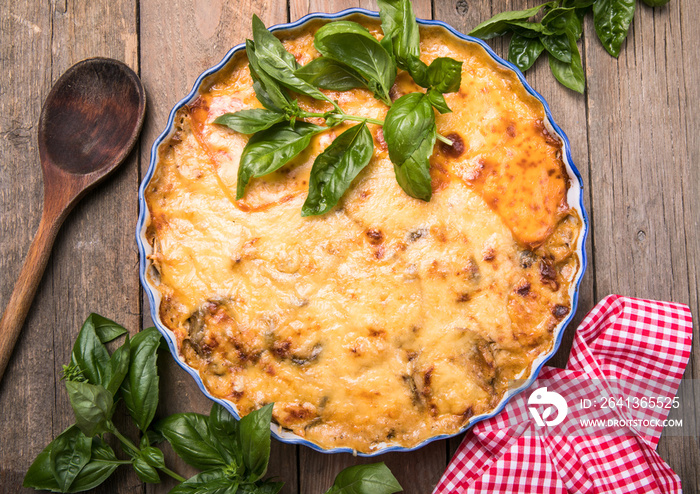 Musaka close-up side view. Traditional Greek dish of baked layers, eggplant, meat, Bechamel sauce