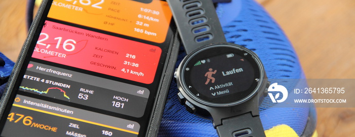 a fitness watch and a smartphone with the text  heart rate, calories, jogging and time