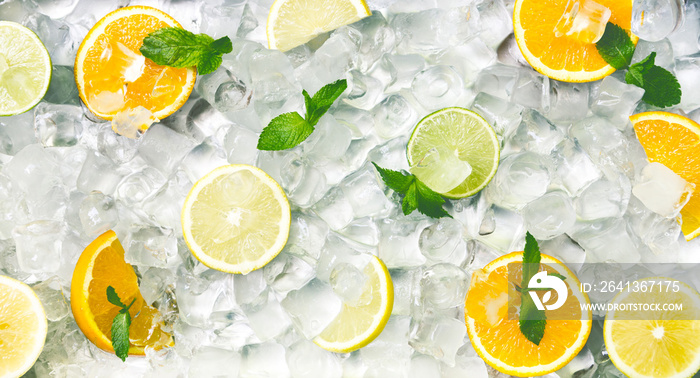 Summer background with fresh and juicy citrus fruits on ice