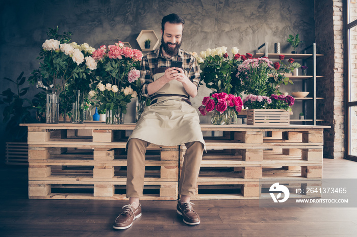 Full length body size view of his he nice attractive cheerful guy gardener sitting chatting with cli