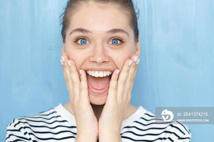 Close up portrait of female with Oh my god, WOW emotion expression. Pleasantly surprised smiling you