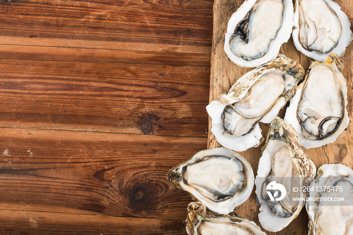 Opened oysters,Fresh oysters on a wooden background