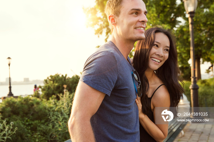 Young couple smiling in park