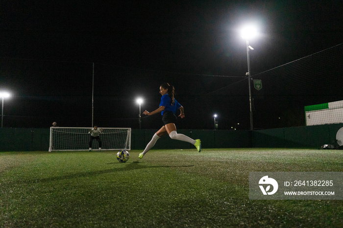 Young women playing soccer