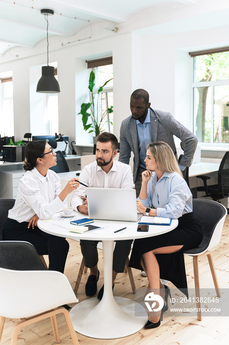 Multi-ethnic business people during meeting in modern office