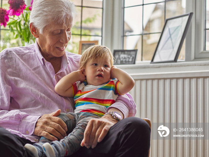 Boy sitting on grandfathers laps