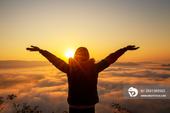 woman tourist enjoying with foggy sunrise