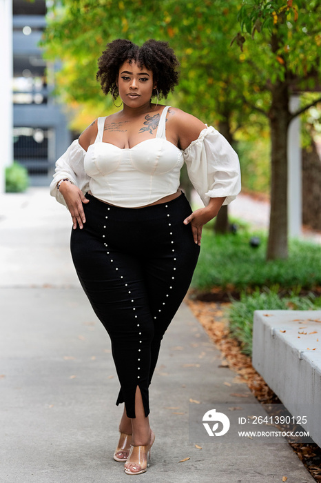 Plus size fashion forward Black woman outside