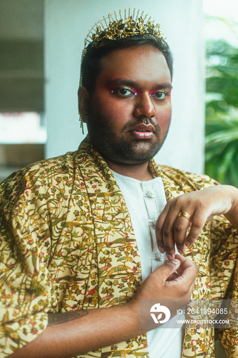 portrait of gay dark skinned indian man in abandoned building