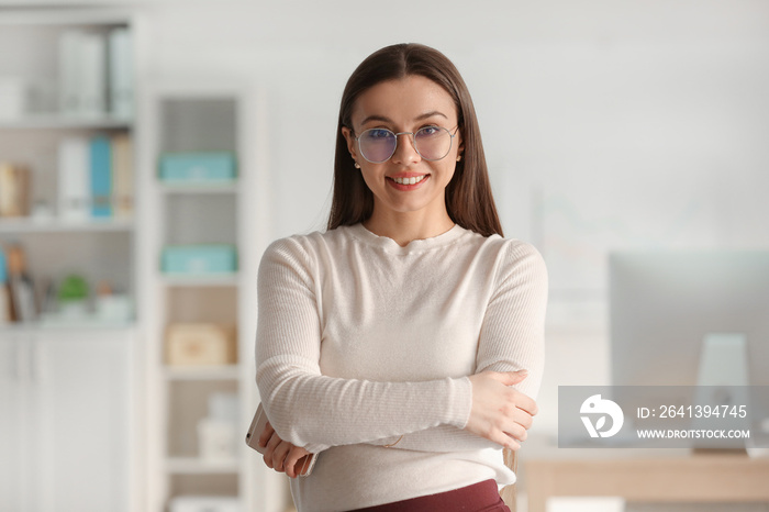 Portrait of stylish businesswoman in office