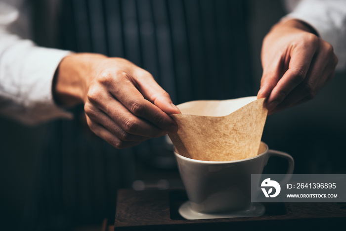 barista showing coffee filter paper, coffee cafe and barista brewing concept