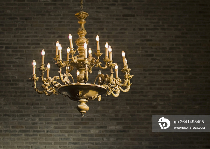 Chandelier and Brick Wall