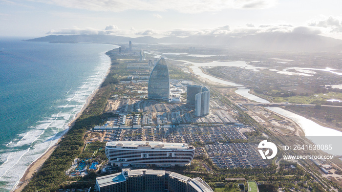 Aerial view of Haitang Bay, Sanya, Hainan, China. Top View of luxury beach with palm trees against t