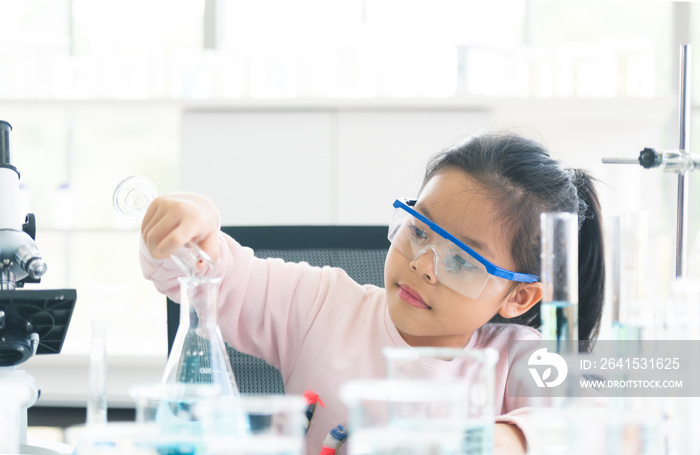 little asia kids girl in lab learning chemistry in.