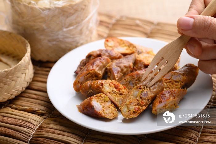 Northern Thai sausage (Sai Aua), Grilled intestine stuffed with minced pork, spices and herbs, popul