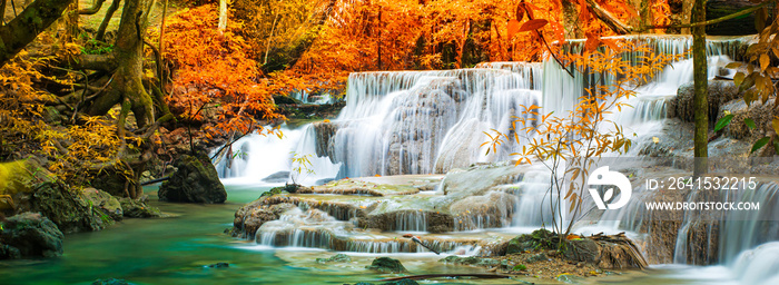 Amazing in nature, beautiful waterfall at colorful autumn forest in fall season