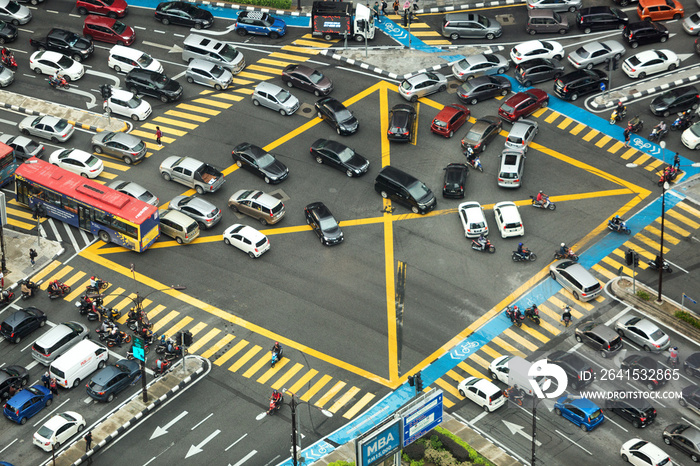 Aerial view looking down onto very busy intersection with heavy traffic