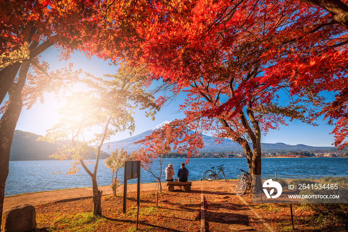 Mt. Fuji over Lake Kawaguchiko with autumn foliage and couple love at sunrise in Fujikawaguchiko, Ja