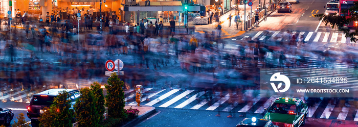 People and traffic cross the famous scramble intersection in Shibuya, Tokyo, Japan, one of the busie