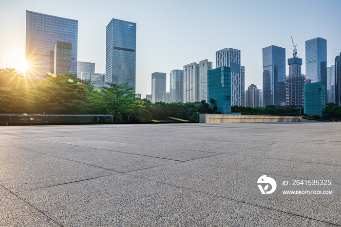 Empty square floor and city skyline with modern commercial office buildings in Shenzhen, China.