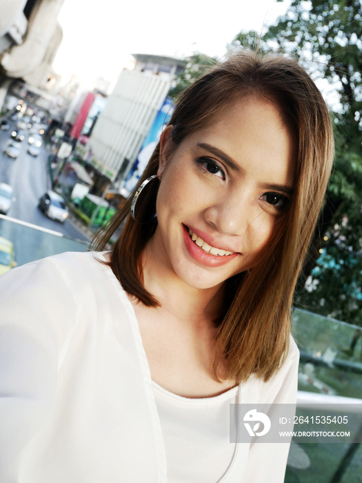 Close-up beautiful Asia woman selfie portrait and traveling in capital city.