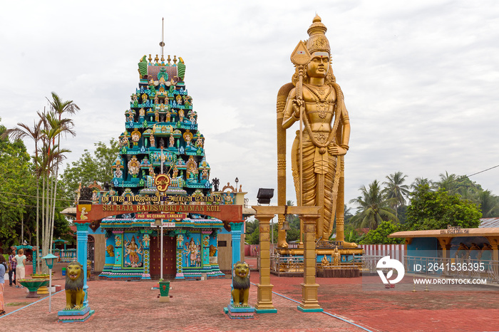 Beautiful view of a large golden Kartikeya (aka Murugan, Skanda, Kumara, Subrahmanya) statue at the 