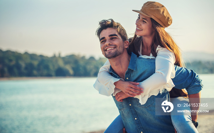 Couple having fun on the beach. Lifestyle, love, dating, vacation concept