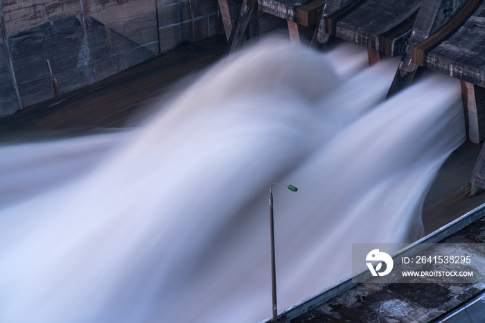 Smooth draining water from the hydroelectric dam at dawn