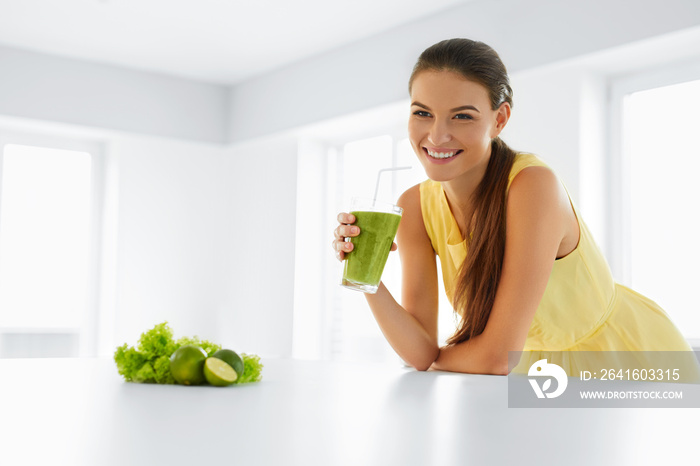 Healthy Meal. Happy Beautiful Smiling Woman Drinking Green Detox Vegetable Smoothie. Healthy Lifesty