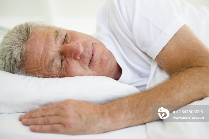 Man lying in bed sleeping