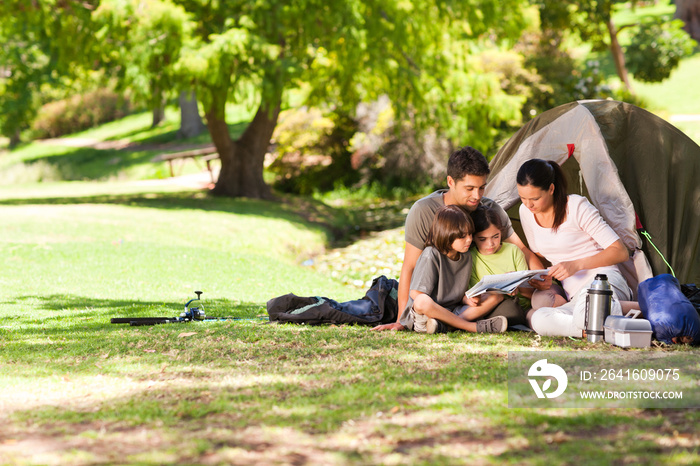 Joyful family camping in the park