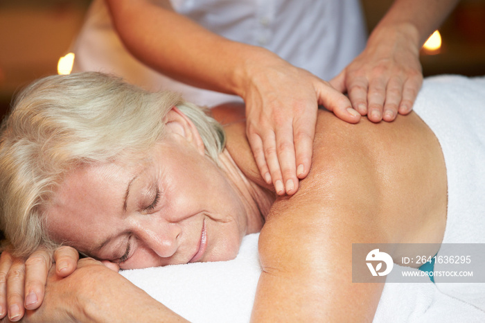 Senior Woman Having Massage In Spa