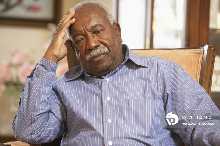 Senior man relaxing in armchair