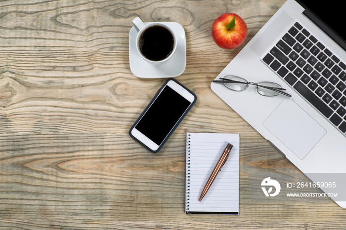 Tidy workspace with red apple and coffee for break