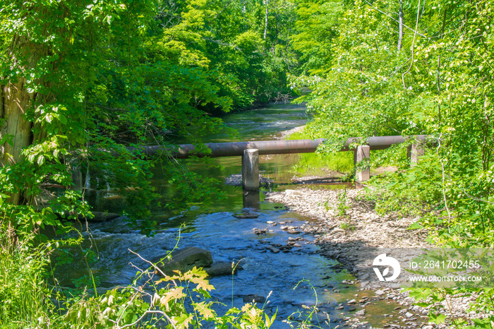 Pipeline running over a brook