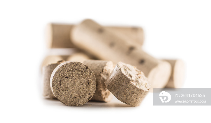 Wooden pressed briquettes from biomass on a white isolated background.