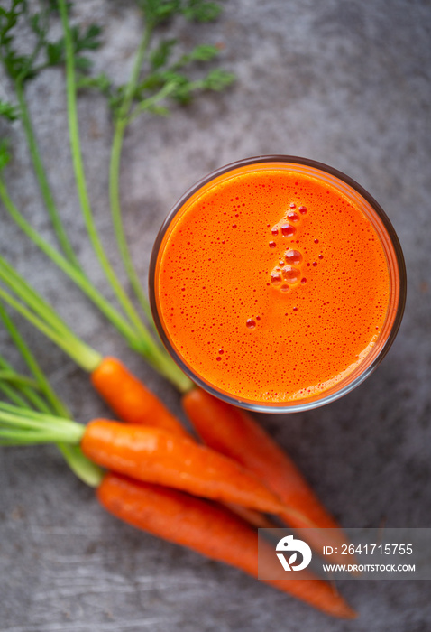 Overhead view of healthy and  delicious homemade carrot juice with copy space