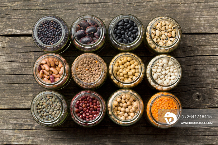 various dried legumes in jars