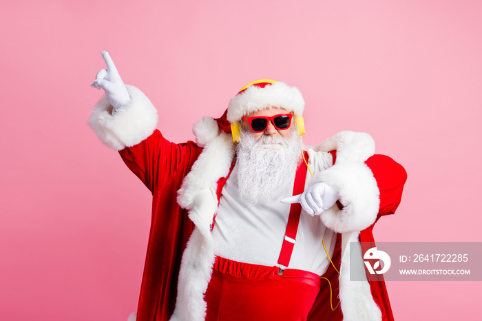 Photo of funky cool big abdomen santa claus enjoy listen headphones x-mas christmas songs radio rais