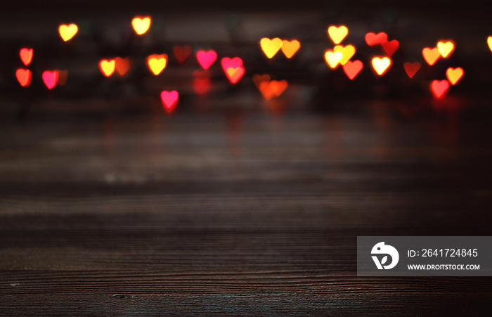 Heart bokeh, Valentines day concept on wooden background